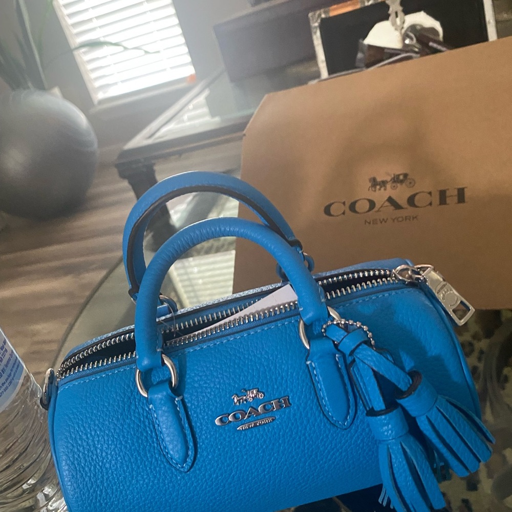 Coach mini top grain leather dual strap/handle. Fits an iPhone 8